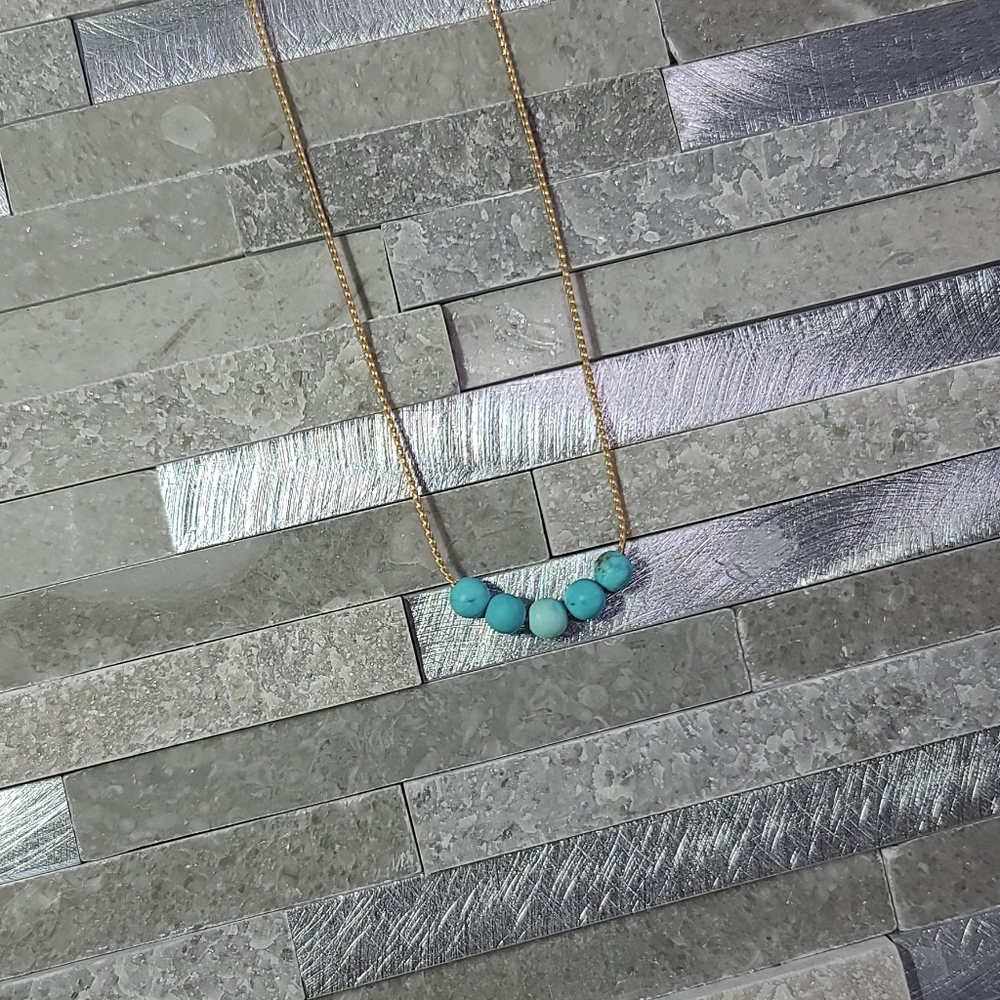 Gold tone and turquoise necklace